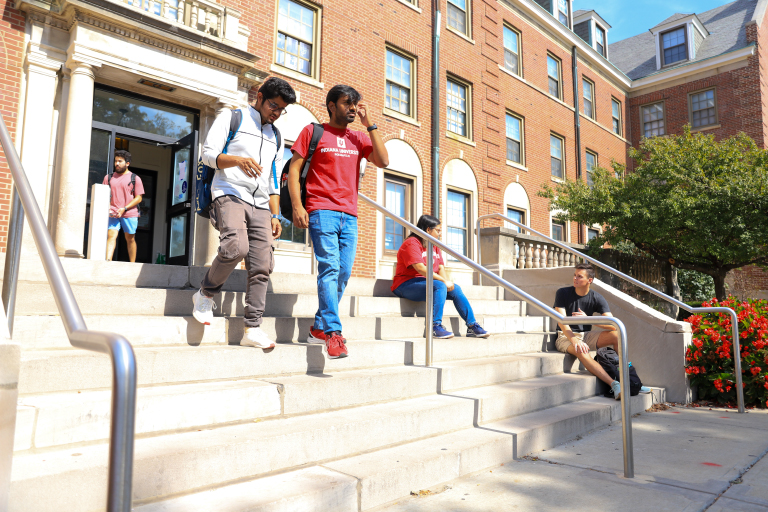 Students hanging outside in front of Ball Hall.